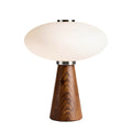 **Moderne tafel lamp met houten voet en ovale lampenkap**